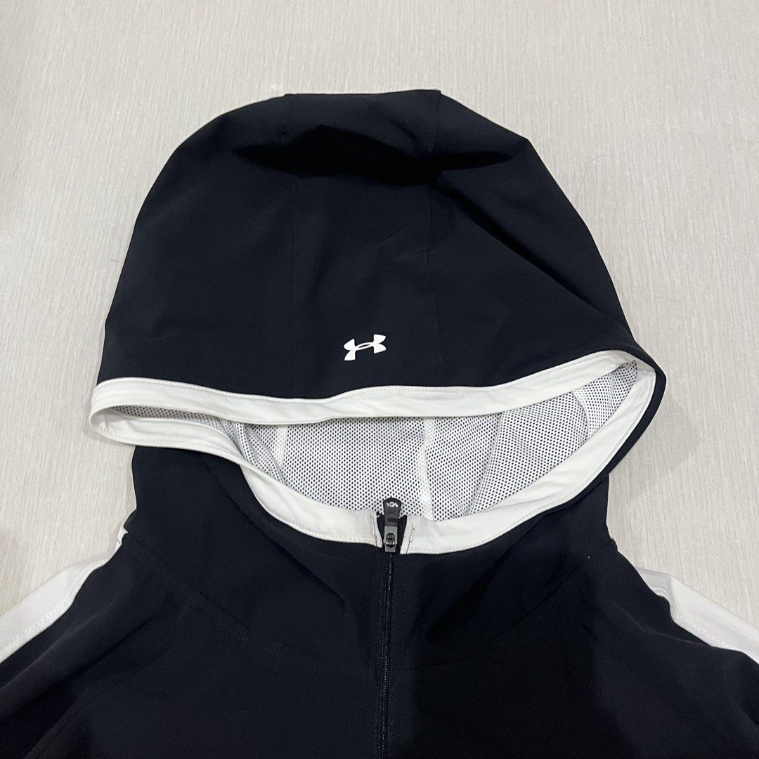 Under Armour Black White Hoodie Jacket (Category: Coats, Jackets and Outerwear) located in Dagupan City. Submitted by deborahthriftshop (Listing ID 1461945449, Image 3). Description: - Black Under Armour hoodie jacket - White stripe details on sleeves and hood - Full zipper closure - Lightweight material, ideal for workouts or casual wear - Under Armour logo featured on chest and back.