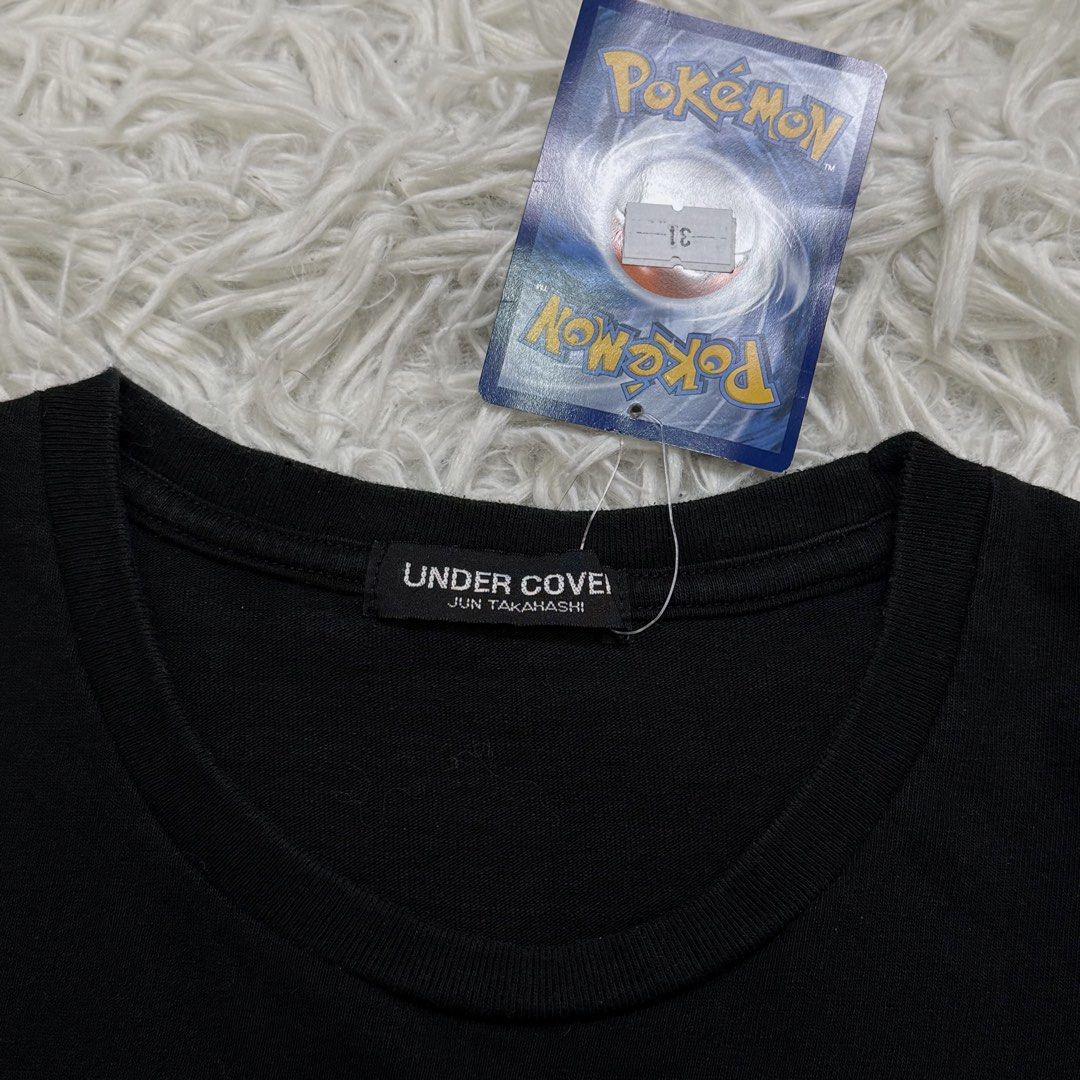Undercover (Category: Tshirts & Polo Shirts ) located in Baguio. Submitted by sellingtonshop (Listing ID 1461835975, Image 3). Description: r31. Undercover Jun Takahashi logo tee Size: 3 fits L Dimes: 27*22 Condition: excellent color rate: 9.5/10 Issue: none Mine: 680 Steal: 780 Grab: 880.