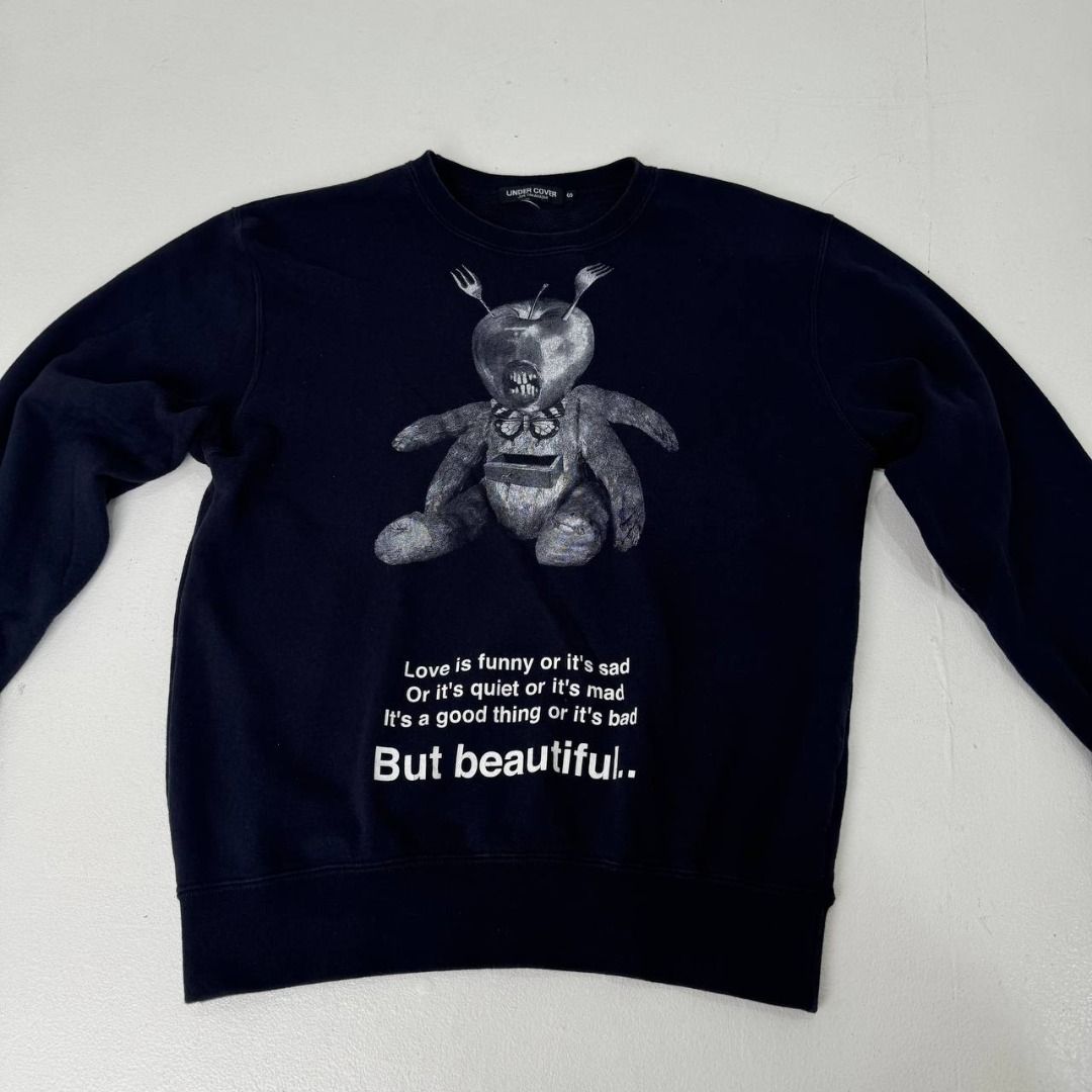 Undercover Teddy But Beatiful L/S crewneck (Category: Luxury Apparel) located in Quezon City. Submitted by johnpaulperezzz (Listing ID 1461904529, Image 2). Description: NAME: Undercover Teddy But Beatiful L/S crewneck COLOR: Black SIZE: Small FIT: Small Dimension: Width: 20 Length: 24 Shoulder: 18 Sleeves: 22 Hem: 15-19 CONDITION: 8.5/10 ISSUE: -crack print at the front of the tee PRICE: 3k .