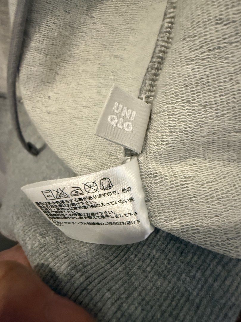 UNI QLO Grey Zip-Up Hoodie (Category: Coats, Jackets and Outerwear) located in Makati City. Submitted by jcalmartz (Listing ID 1461816974, Image 2). Description: - UNIQLO Grey Zip-Up Hoodie - Features a hood - Front pockets for convenience - Ideal for casual outings - Great for layering.