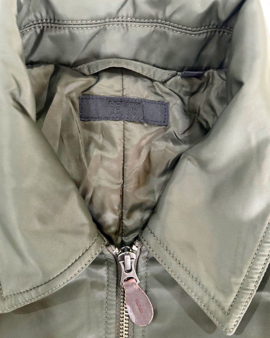 NEW MARKDOWN!! Uniqlo Bomber Jacket - Olive Green - Size M (Category: Coats, Jackets and Outerwear) located in Quezon City. Submitted by strangesuitcase (Listing ID 1461977739, Image 2). Description: - Uniqlo Flight / Collared Bomber Jacket - Color: Olive Green - Size: Medium (M) - Dimensions: chest 22"/length 25"/waist 20"/sleeve length 23" - Material: Nylon & Polyester Blend - Origin: Made in Vietnam - Style: Classic bomber with collar - Closur