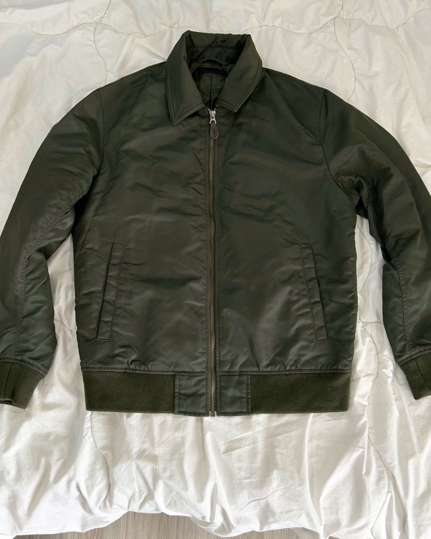 NEW MARKDOWN!! Uniqlo Bomber Jacket - Olive Green - Size M (Category: Coats, Jackets and Outerwear) located in Quezon City. Submitted by strangesuitcase (Listing ID 1461977739, Image 1). Description: - Uniqlo Flight / Collared Bomber Jacket - Color: Olive Green - Size: Medium (M) - Dimensions: chest 22"/length 25"/waist 20"/sleeve length 23" - Material: Nylon & Polyester Blend - Origin: Made in Vietnam - Style: Classic bomber with collar - Closur