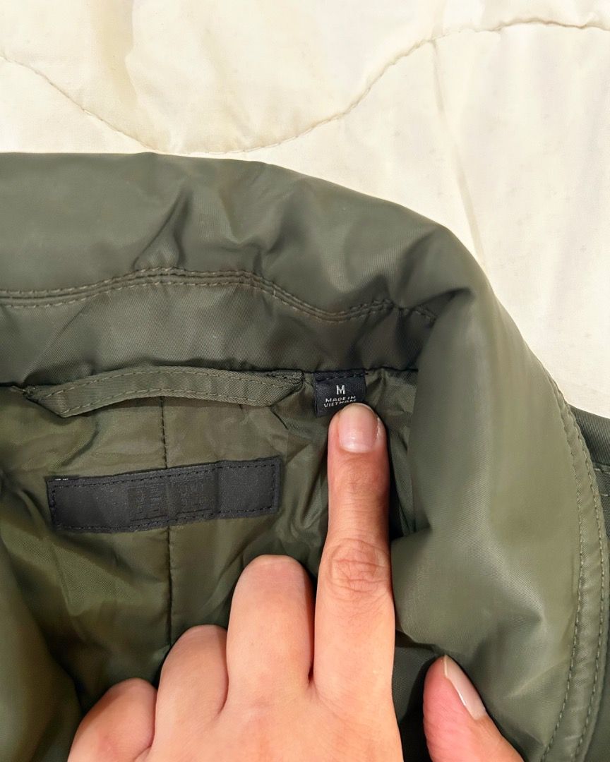 NEW MARKDOWN!! Uniqlo Bomber Jacket - Olive Green - Size M (Category: Coats, Jackets and Outerwear) located in Quezon City. Submitted by strangesuitcase (Listing ID 1461977739, Image 3). Description: - Uniqlo Flight / Collared Bomber Jacket - Color: Olive Green - Size: Medium (M) - Dimensions: chest 22"/length 25"/waist 20"/sleeve length 23" - Material: Nylon & Polyester Blend - Origin: Made in Vietnam - Style: Classic bomber with collar - Closur