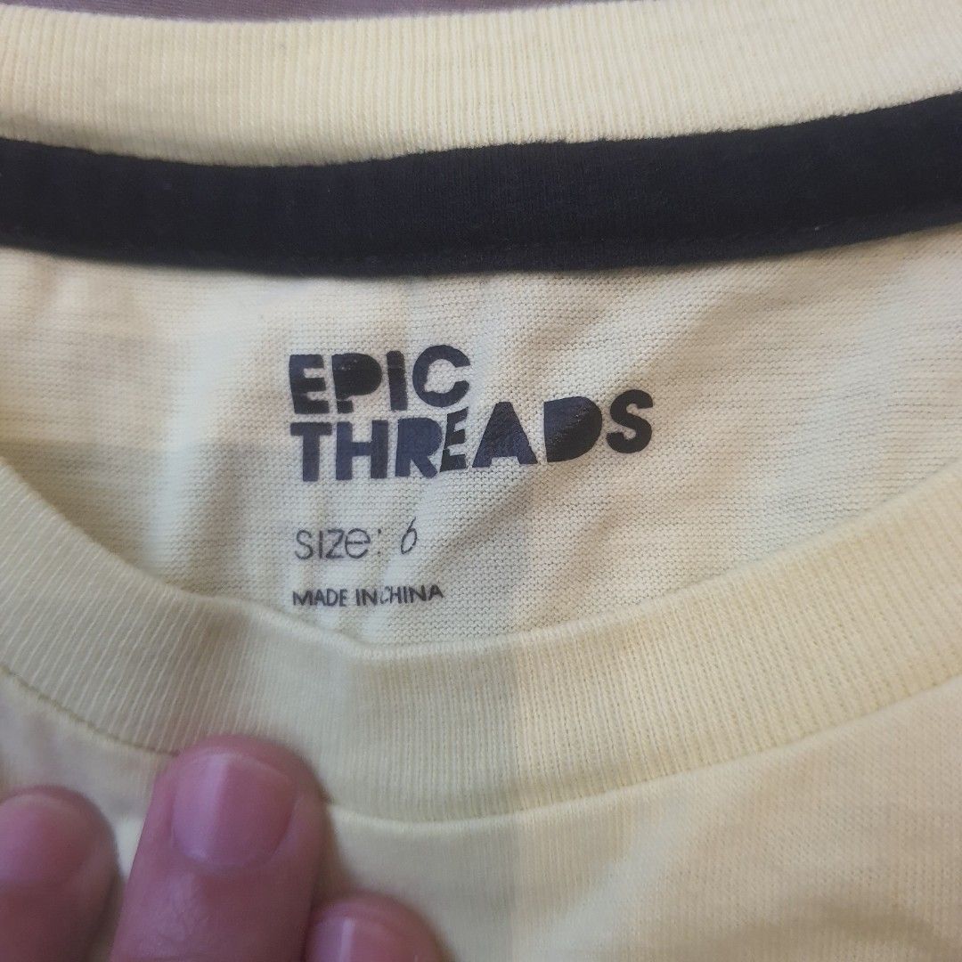 Uniqlo, Epic Threads, link T-Shirts 14pc bundle (Category: Shirts) located in Quezon City. Submitted by wenaileditconstruction (Listing ID 1461891813, Image 3). Description: - Bundle of 14 kids' t-shirts - Brands include Uniqlo (size 110) and Epic Threads (size 6) - Features a black Valentino 'VLTN' tee - Includes a beige tee with vintage car graphic - Also a patterned tee - Assorted colors: orange, white, pink, peach, yellow, blue, grey, teal - 