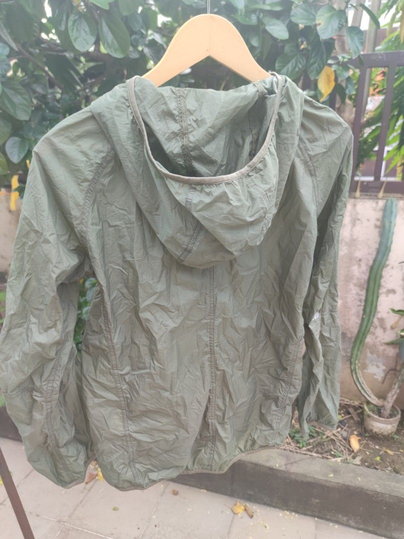 Uniqlo Ultra Light Down Hooded Jacket (Category: Coats, Jackets and Outerwear) located in Pasig City. Submitted by ftwind (Listing ID 1461821760, Image 2). Description: - Uniqlo Ultra Light Down Jacket - Olive Green - Ultra lightweight and packable design - Features a full zip front and hood - Water repellent fabric - Ideal for travel, layering, windy days, and light rain.