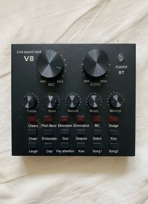 V8 Live Sound Card Audio Mixer (Category: Other Audio Equipment) located in Quezon City. Submitted by SustainableFashionatbp (Listing ID 1461941216, Image 2). Description: - V8 Live Sound Card - Controls for Mic and Echo levels - Knobs for Treble, Bass, Record, Music, and Monitor - Multiple Sound Effect buttons (Electro, Pitch Bend, Gun, Kiss, etc.) - Ideal for Live Streaming and Recording --Lost cables and boom mic stand.