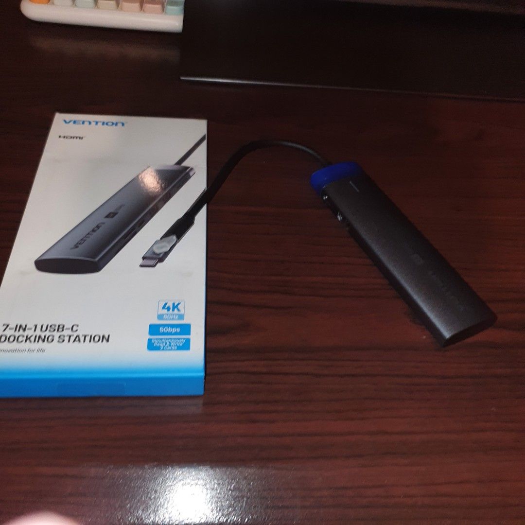 Vention 7-in-1 USB-C Docking Station 4K HDMI (Category: Cables & Adaptors) located in Pasig City. Submitted by mr.bargaindeal (Listing ID 1461798516, Image 2). Description: - Vention 7-in-1 USB-C Docking Station - Supports stunning 4K HDMI output for external displays - Enjoy fast 5Gbps data transfer speeds - Multiple ports to connect all your essential peripherals - Compact and portable design for on-the-go use - Effortlessly expand your laptop'