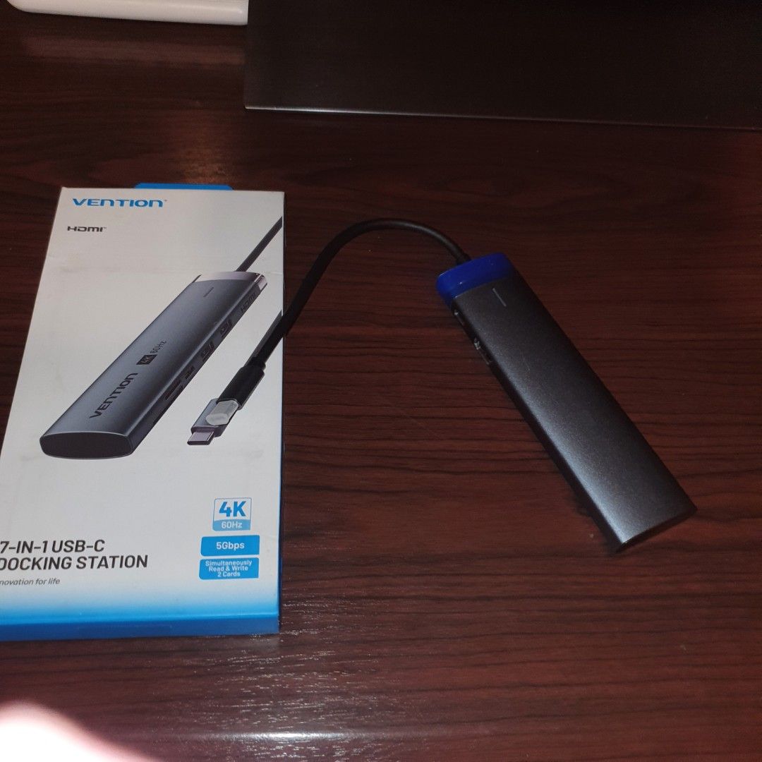 Vention 7-in-1 USB-C Docking Station 4K HDMI (Category: Cables & Adaptors) located in Pasig City. Submitted by mr.bargaindeal (Listing ID 1461798516, Image 1). Description: - Vention 7-in-1 USB-C Docking Station - Supports stunning 4K HDMI output for external displays - Enjoy fast 5Gbps data transfer speeds - Multiple ports to connect all your essential peripherals - Compact and portable design for on-the-go use - Effortlessly expand your laptop'