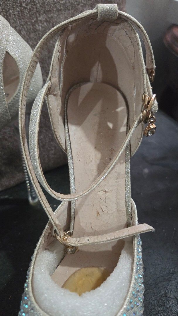 Venus Sparkly Platform Heels with Ankle Strap (Category: Heels) located in Quezon City. Submitted by kctheexplorer05 (Listing ID 1461863068, Image 3). Description: - Silver sparkly platform heels - Ankle strap with buckle closure - Clear block heel - Size 42 / 6 inches heels - Shows some wear on insoles and soles (see photos for reference) - Ideal for parties, special occasions, pageants .