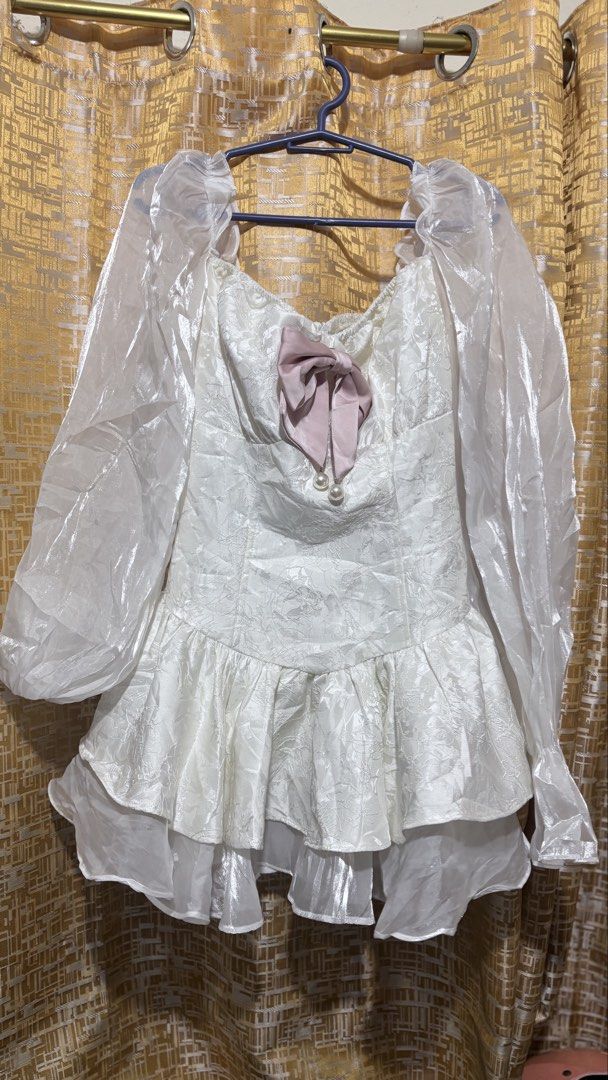 Vietnam dress coquettes (Category: Dresses) located in Marikina City. Submitted by lily.ca (Listing ID 1461914523, Image 3). Description: - White off-shoulder dress - Puff sleeves with sheer organza - Textured fabric with floral pattern - Ruffled hem - Cute pink bow detail on bust - Ideal for parties and events - Sweet and feminine style Large on tag but i think small to medium lang sya .