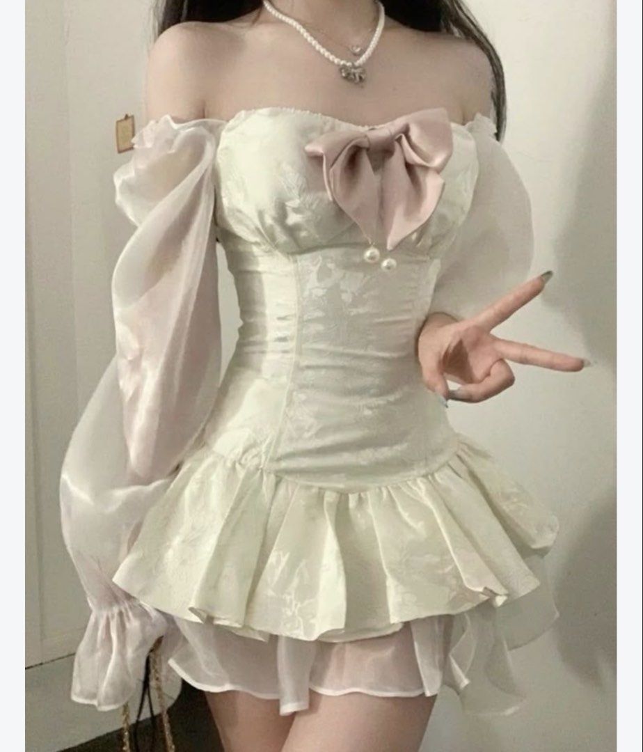 Vietnam dress coquettes (Category: Dresses) located in Marikina City. Submitted by lily.ca (Listing ID 1461914523, Image 2). Description: - White off-shoulder dress - Puff sleeves with sheer organza - Textured fabric with floral pattern - Ruffled hem - Cute pink bow detail on bust - Ideal for parties and events - Sweet and feminine style Large on tag but i think small to medium lang sya .