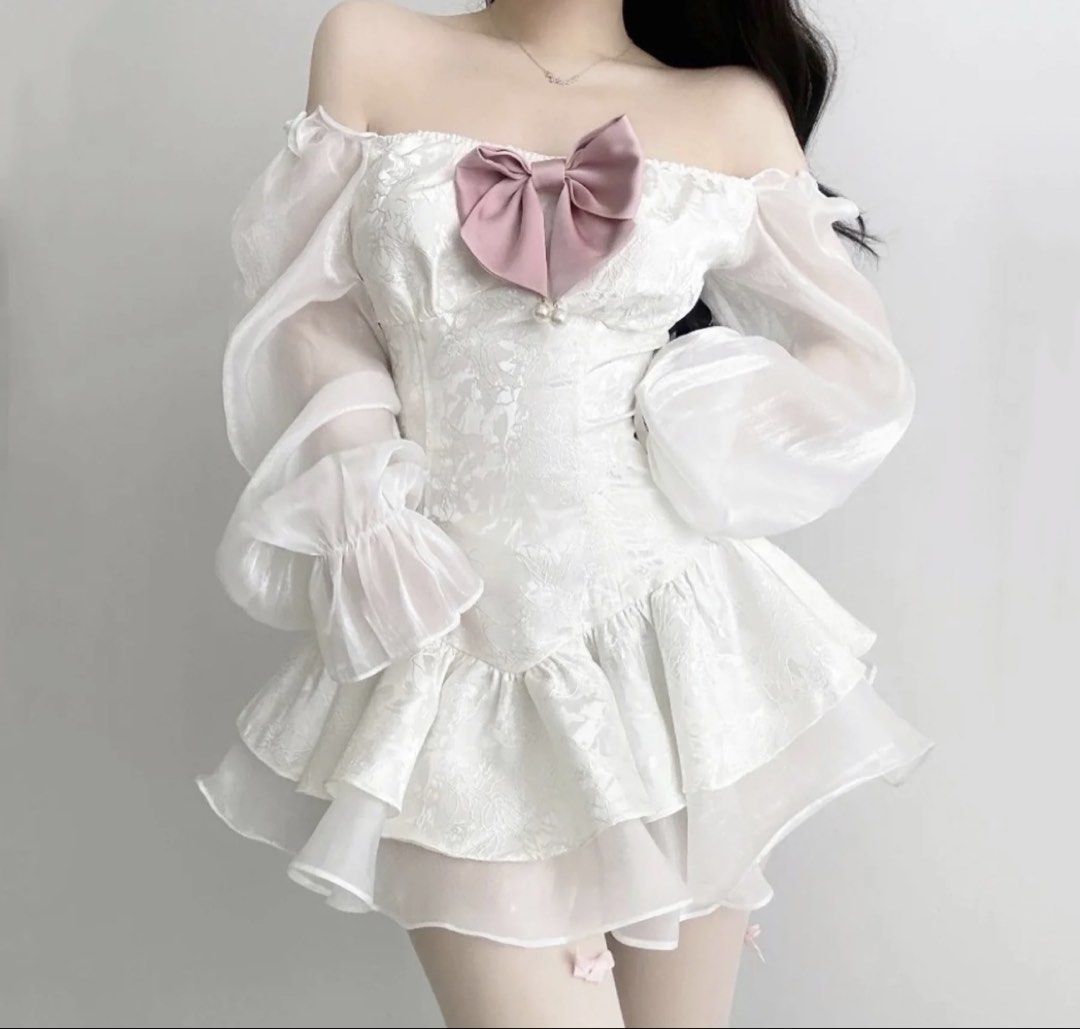 Vietnam dress coquettes (Category: Dresses) located in Marikina City. Submitted by lily.ca (Listing ID 1461914523, Image 1). Description: - White off-shoulder dress - Puff sleeves with sheer organza - Textured fabric with floral pattern - Ruffled hem - Cute pink bow detail on bust - Ideal for parties and events - Sweet and feminine style Large on tag but i think small to medium lang sya .