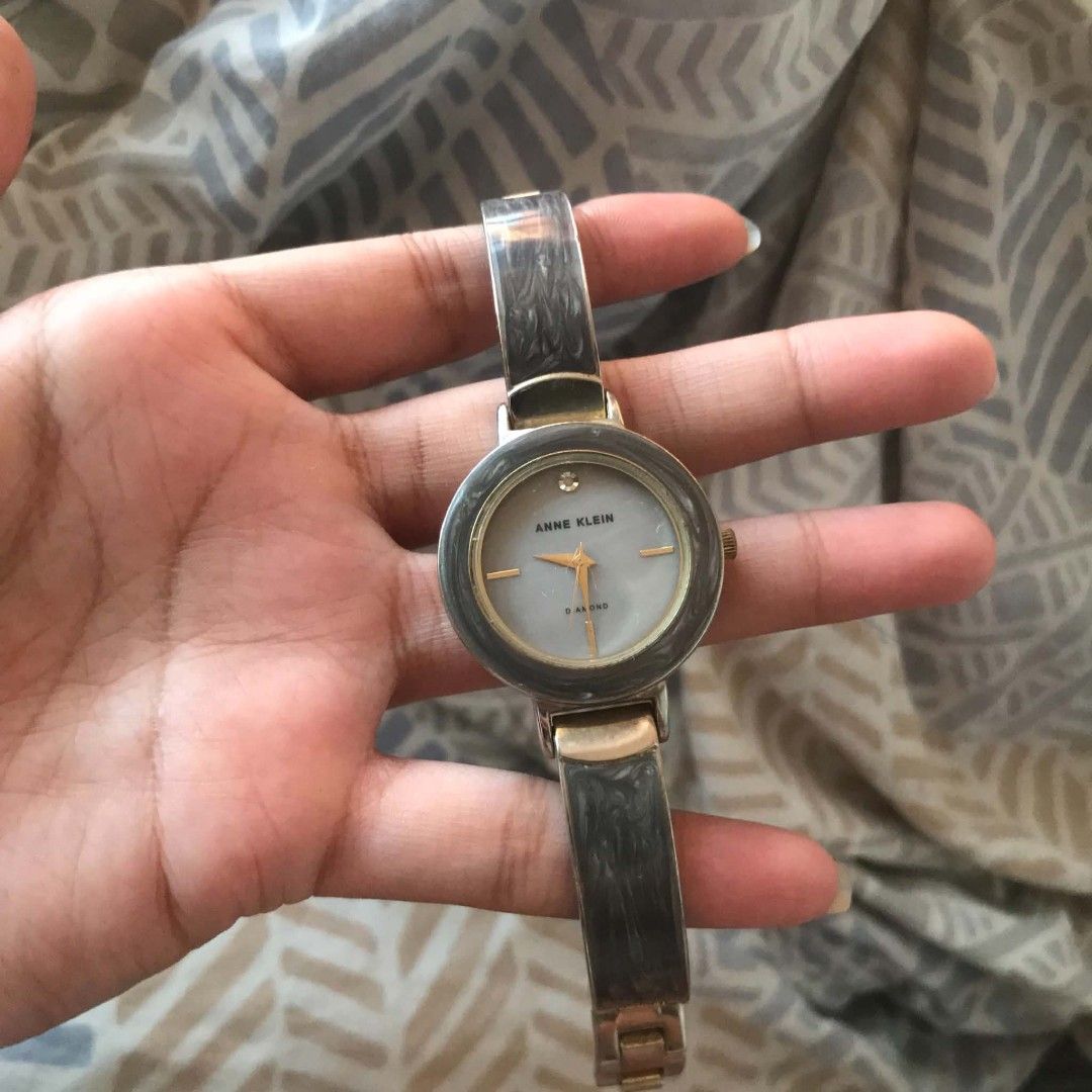 Vintage Authentic Anne Klein grey marble bangle Watch (Category: Women's Watches) located in San Juan City. Submitted by mrs.mocanu (Listing ID 1461988835, Image 3). Description: Anne Klein grey marble bangle watch featuring a distinctive marbled resin and gold-tone bracelet with a single diamond accent at the 12 o'clock position..