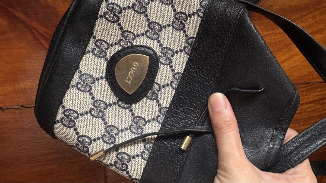 Vintage Gucci Monogram Shoulder Bag (Category: Luxury Bags & Wallets) located in Quezon City. Submitted by kb0030 (Listing ID 1461956155, Image 2). Description: - Classic Gucci shoulder bag - Iconic GG monogram canvas - Black leather trim - Secure drawstring closure - Soft interior lining - Adjustable leather strap - Timeless and versatile piece.