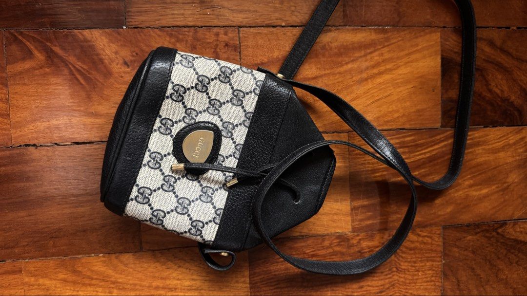 Vintage Gucci Monogram Shoulder Bag (Category: Luxury Bags & Wallets) located in Quezon City. Submitted by kb0030 (Listing ID 1461956155, Image 1). Description: - Classic Gucci shoulder bag - Iconic GG monogram canvas - Black leather trim - Secure drawstring closure - Soft interior lining - Adjustable leather strap - Timeless and versatile piece.
