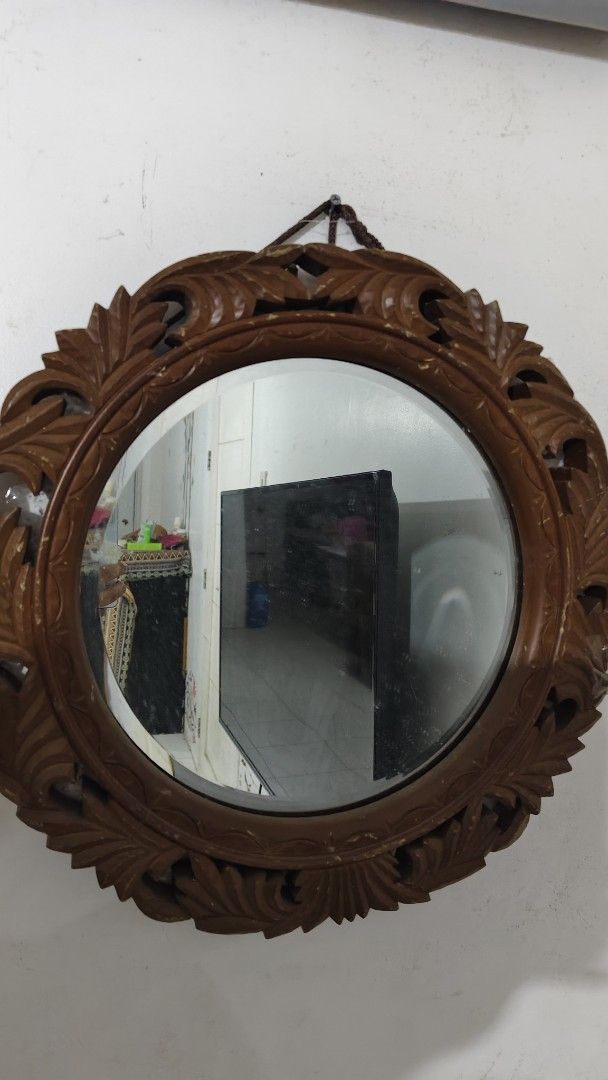 Vintage Oval Carved Wood Frame Mirror (Category: Mirrors) located in Bulacan. Submitted by babz30261 (Listing ID 1461963883, Image 3). Description: - Vintage oval mirror - Beautifully carved wooden frame with intricate leaf patterns - Warm, brown finish - Ready to hang on your wall - Adds a classic touch to any room - Perfect for hallways or entryways.