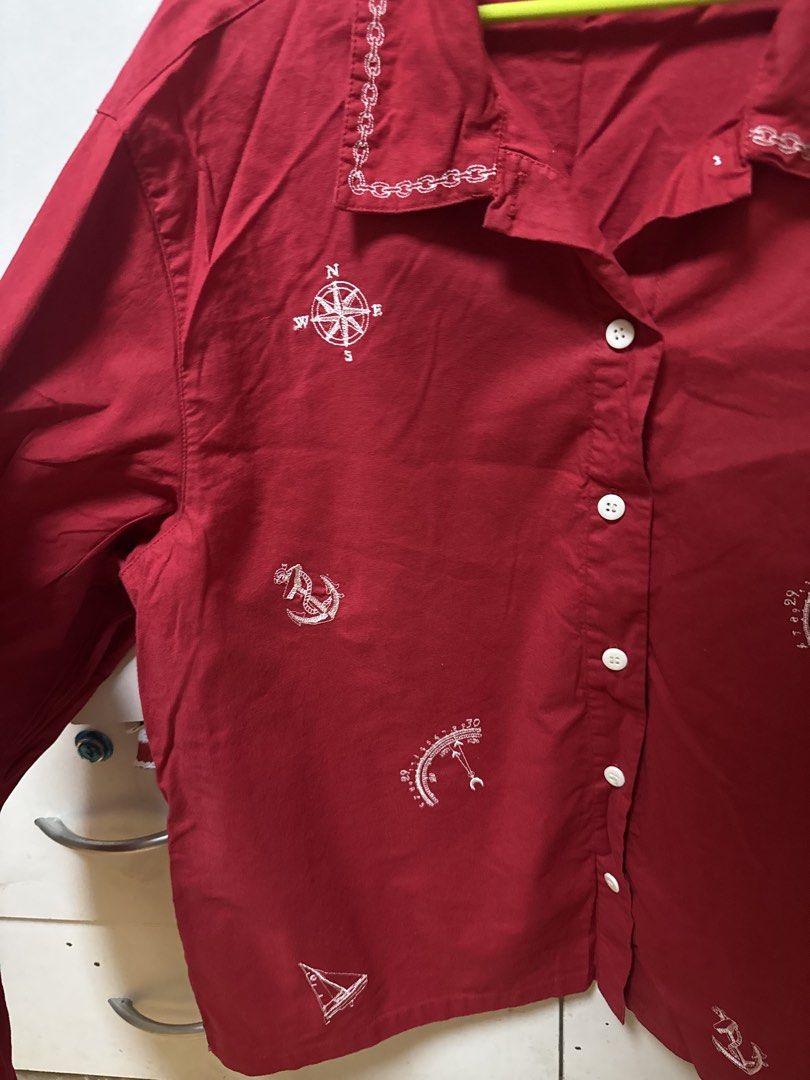 Vintage Red Nautical Print Button-Up Shirt (Category: Coats, Jackets and Outerwear) located in Manila. Submitted by quintessesommerset (Listing ID 1462026989, Image 2). Description: - Sophia Brooks red long-sleeved shirt 23x27.5 - Nautical print featuring compasses, sailboats, and anchors - Button-up front with white buttons - Unique chain-link embroidery detail on the collar - Ideal for a casual, preppy aesthetic.