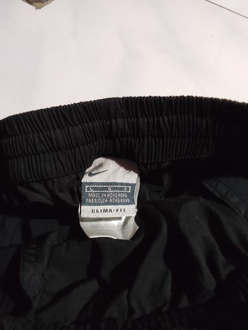 Vintage y2k Nike pants embroid (Category: Joggers) located in Cavite. Submitted by ara.thrifts (Listing ID 1461813211, Image 3). Description: - Black Nike track pants - Clima-Fit material for comfort - Elastic waistband with adjustable drawstring - Convenient pockets - Adjustable drawstring at the ankles - Made in Hong Kong - Size: Large (L) width "16" length "39" no issue bnew 10/10 cr.