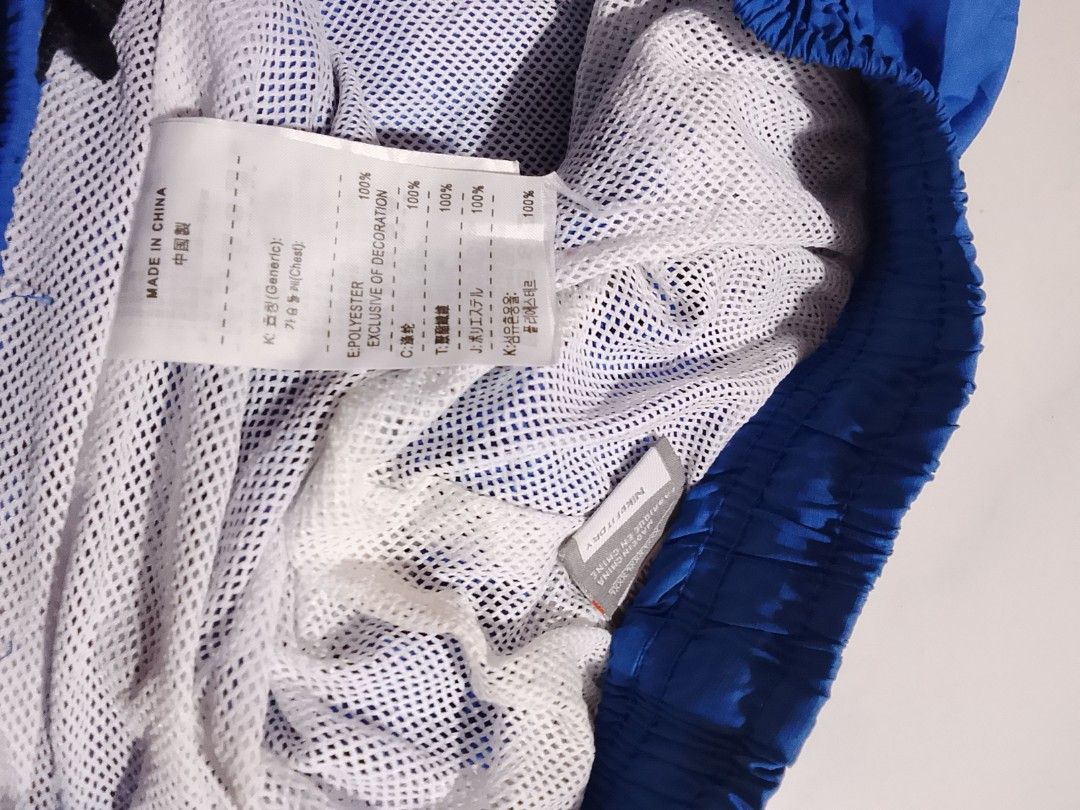 Vintage y2k Nike pants embroid (Category: Joggers) located in Cavite. Submitted by ara.thrifts (Listing ID 1461813604, Image 3). Description: - Blue Nike track pants - Chinese characters and Nike logo on the left leg 2xl width "17" length "41" no issue bnew 10/10 cr.
