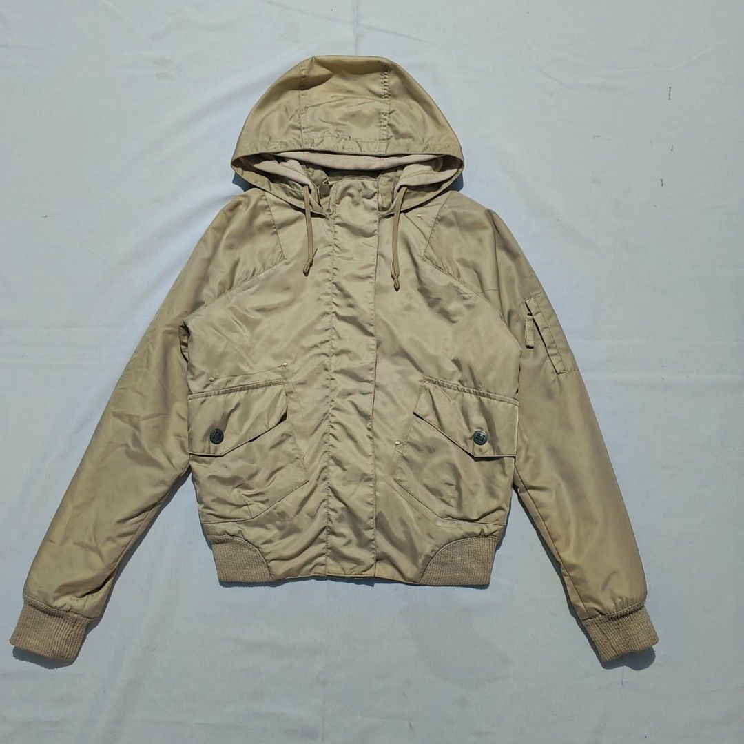 VINTAGE-STYLE DC Hooded Bomber/Windbreaker Jacket (Category: Coats, Jackets and Outerwear) located in Baguio. Submitted by mir_yam.elias (Listing ID 1461958564, Image 1). Description: ‎DC Hooded Bomber/Windbreaker Jacket ‎vintage-style hooded nylon Bomber/Windbreaker jacket beige in color featuring a front zipper, ribbed hem and cuffs, dual front flap pockets, and a utility pocket on the sleeve ‎Fits S on Mens; S-M womens ‎S on tag ‎W 51.5 cm ‎Ne