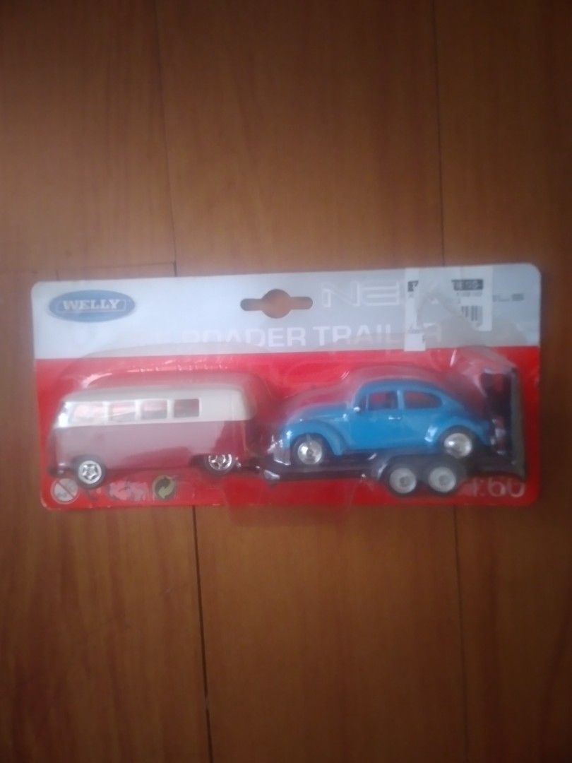 Welly Blue Car Trailer Toy (Category: Vehicle & Diecast Models) located in Manila. Submitted by howiebowie19_77 (Listing ID 1461831204, Image 2). Description: - Welly toy car and trailer set - Features a blue car with a white trailer - Brand new, still in original packaging - Ideal for toy car collectors - Great fun for kids who love cars pick up dito sa bahay or puwede niyo pa lalamove or grab kayo set sa address ko (buyers exp) display lang sa 