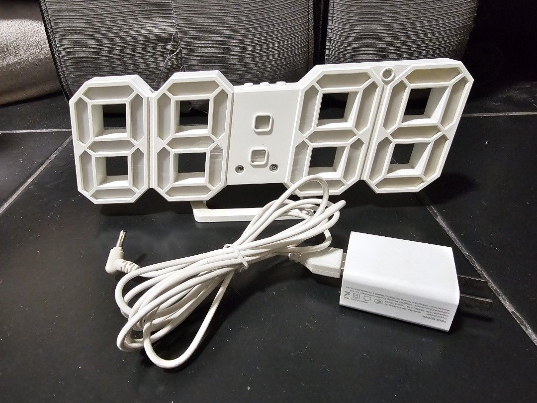 White 3D LED Digital Clock with Power Adapter (Category: Clocks) located in Pasig City. Submitted by dmtp7 (Listing ID 1461932717, Image 1). Description: - Modern white 3D LED digital clock - Clear and easy-to-read time display - Includes power adapter and cable - Ideal for desks or bedside tables - Simple setup and operation - Enhances any room with a contemporary feel RFS: decluttering MOP: GCash, bank transfer Location: Pasig City Shipping to 