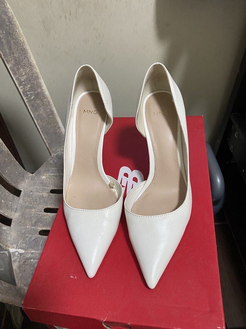 White Mango Pointed Toe Heels (Category: Heels) located in Antipolo. Submitted by jl_2025 (Listing ID 1461899889, Image 1). Description: - Brand: Mango - Style: White pointed toe heels - Design: Classic and easy to pair with any outfit - Condition: Good, with minimal signs of wear - Versatility: Perfect for any occasion Issue: signs of wear as seen on the photo and cat bites. No box sinira ng pusa. I used this handful of times pero nasira na beca