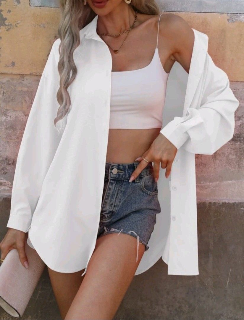 White Oversized Button-Up Shirt (Category: Tshirts & Polo Shirts ) located in Manila. Submitted by monaaa03 (Listing ID 1461892463, Image 2). Description: - Classic white oversized shirt - Long sleeves with button cuffs - Comfortable and breezy fabric - Versatile styling: wear open, layer, or as is - Ideal for casual outings.