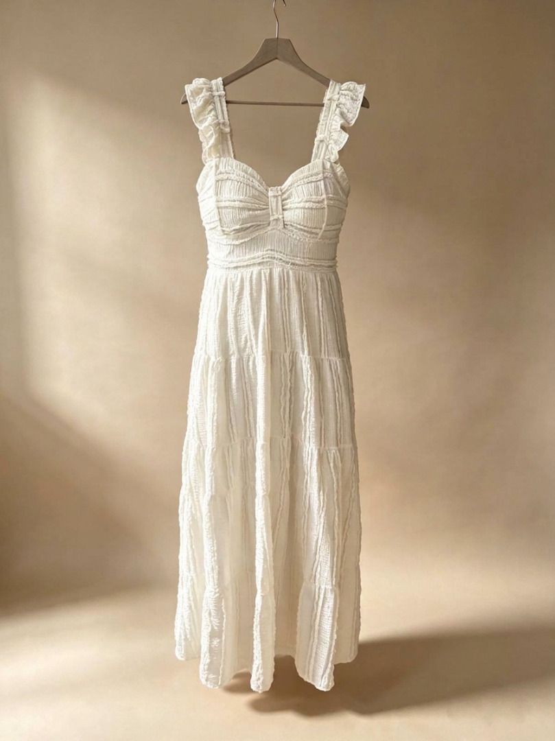 White Ruffled Tiered Maxi Dress (Category: Dresses) located in Manila. Submitted by meedclothing (Listing ID 1461846601, Image 1). Description: - White tiered maxi dress - Padded - Smock at the Back - Sweetheart neckline - Ruffled straps - Textured fabric - Ideal for summer events or beach vacations - Easy to dress up or down 📌 PLEASE READ BEFORE ORDERING: ⏳ Reservation: Strictly 2 days only 📦 Shipping: Everyday except Sundays & holidays ♻️ Con