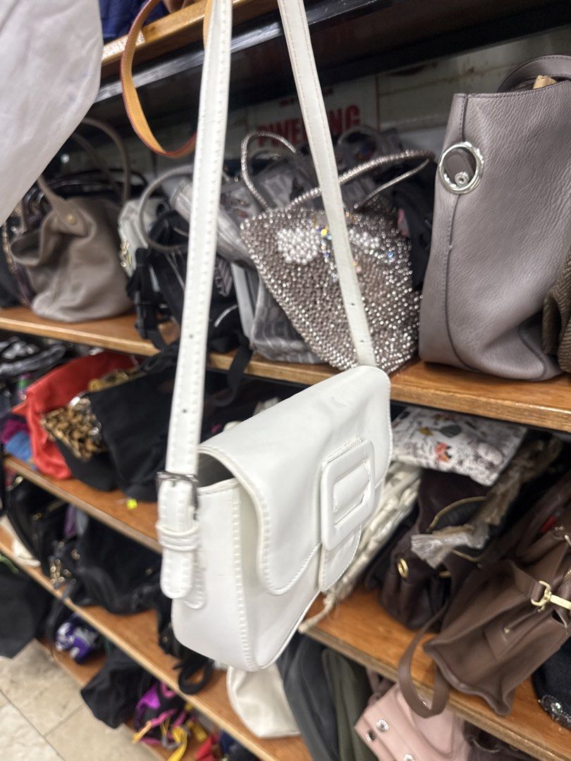 White shoulder bag with buckle detail (Category: Shoulder Bags) located in Manila. Submitted by fastlion.584bdf (Listing ID 1461813997, Image 2). Description: - Stylish white shoulder bag - Secure buckle closure on front flap - Adjustable strap with buckle - Clean and simple design - Ideal for everyday use - Fits all your essentials.