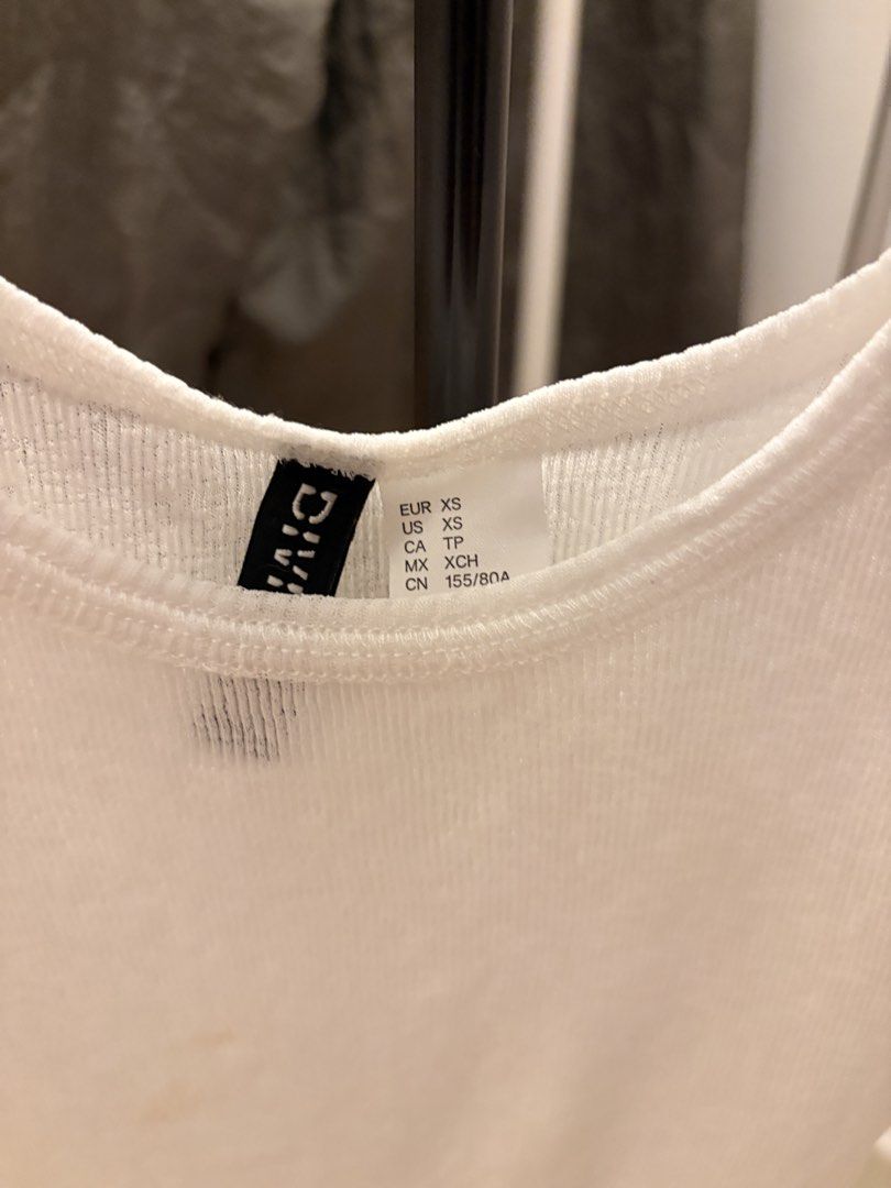 White Tank Top (Category: Sleeveless) located in Mandaluyong City. Submitted by boopiefinds (Listing ID 1461978049, Image 2). Description: Sheer mesh See through top.