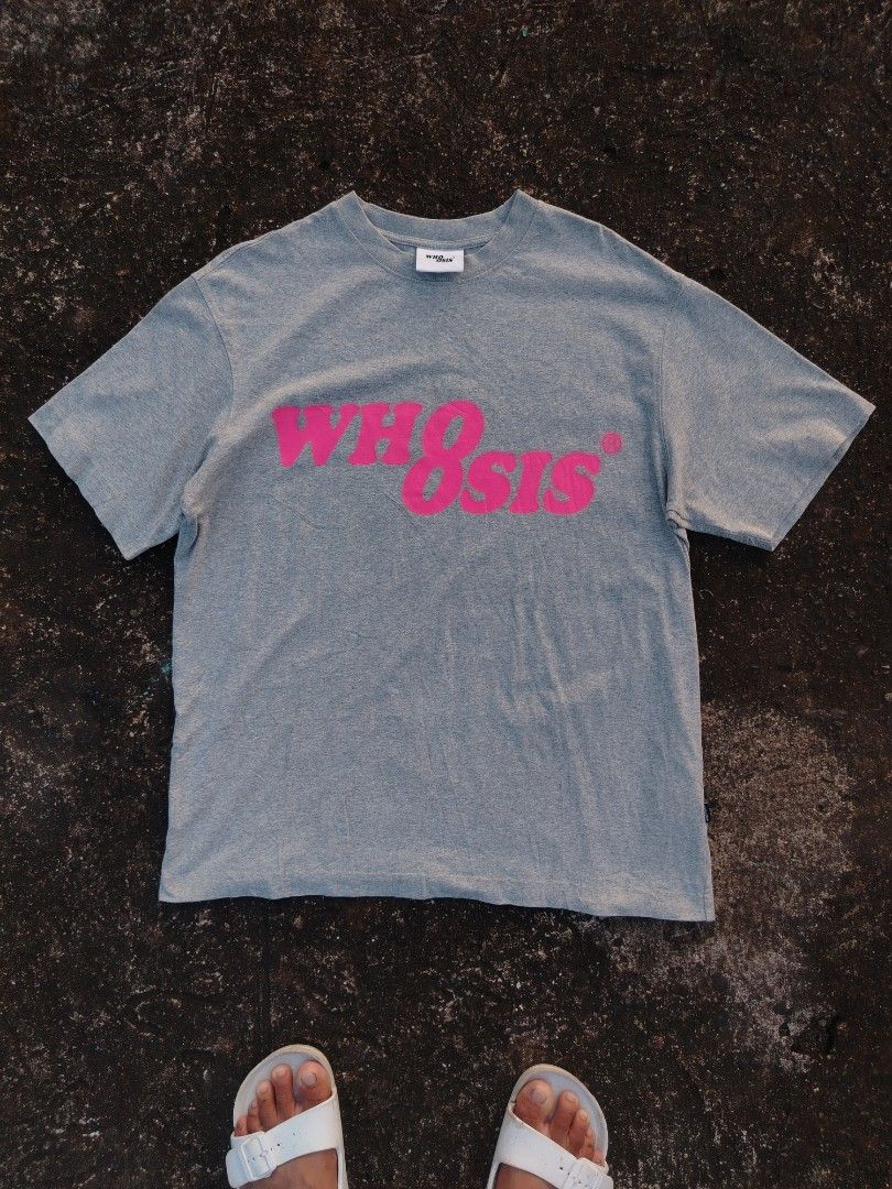 WHOOSIS Grey T-shirt with Pink Logo (Category: Tshirts & Polo Shirts ) located in Santa Maria. Submitted by vincellenard.-2 (Listing ID 1461908982, Image 1). Description: - Brand: WHOOSIS - Color: Grey - Design: Pink logo across chest - Material: 100% Cotton - Size/Dimensions: Width: 22 Length: 28.