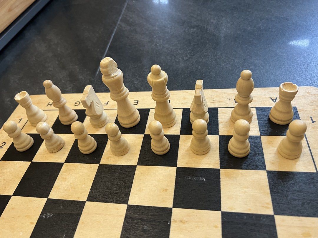Wooden Chess Set with Pieces (Category: Board Games & Puzzles) located in Pasig City. Submitted by yonghan0613 (Listing ID 1461905940, Image 3). Description: - Classic wooden chess board and pieces - Includes all standard light and dark side pieces - Board features clear coordinate markings - Ideal for game nights or as a decorative item - Ready for your next chess match.