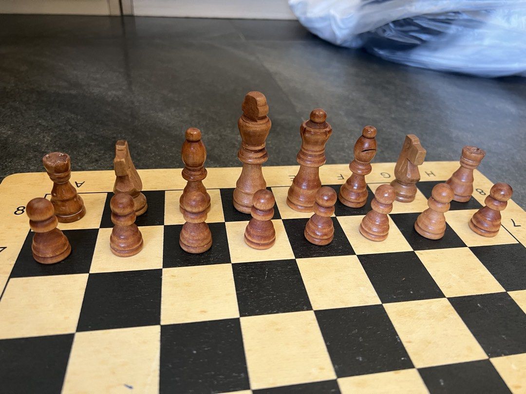 Wooden Chess Set with Pieces (Category: Board Games & Puzzles) located in Pasig City. Submitted by yonghan0613 (Listing ID 1461905940, Image 2). Description: - Classic wooden chess board and pieces - Includes all standard light and dark side pieces - Board features clear coordinate markings - Ideal for game nights or as a decorative item - Ready for your next chess match.