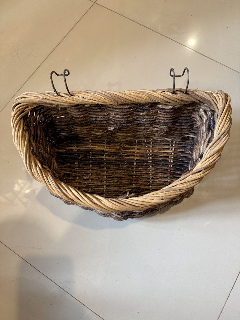 Woven Wicker Basket with Hooks for Hanging (Category: Storage Boxes & Baskets) located in Quezon City. Submitted by slowpopanda (Listing ID 1461979732, Image 2). Description: - Cute woven basket - Features two metal hooks for hanging - Ideal for storage or as a planter - Adds a rustic touch to any space RFS: Never been used In storage for more than a year Paint in the hooks are peeling .