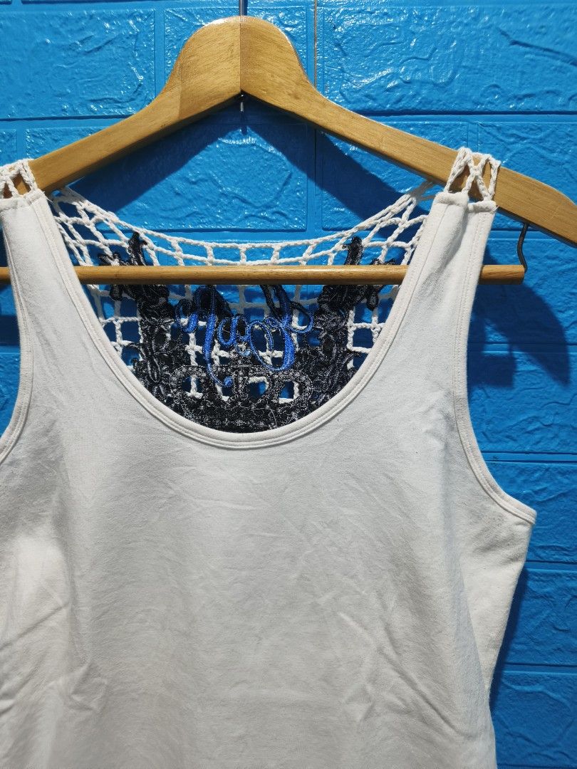 Y2K EXR FUNCTION MADE ITSELF White Tank Top Size M (Category: Sleeveless) located in Davao. Submitted by vndrgd (Listing ID 1461903982, Image 2). Description: - White tank top - Unique crochet back detail - Front hem graphic print with crowns and lions - Measurements: Width 15", Length 25" - Ideal for casual wear.