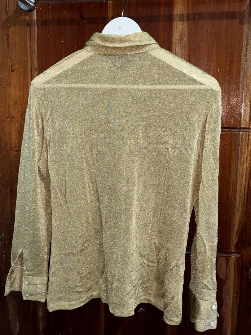 Y2K Gold Sparkly Sheer Button-Up Shirt (Category: Blouses) located in Bauang. Submitted by crazeymuffin (Listing ID 1461806460, Image 3). Description: Gold sparkly sheer shirt. Long sleeves with button cuffs. Classic collar and button-down front. Looks great layered or on its own. Adds a bit of glam to any outfit. Perfect for parties or a night out..