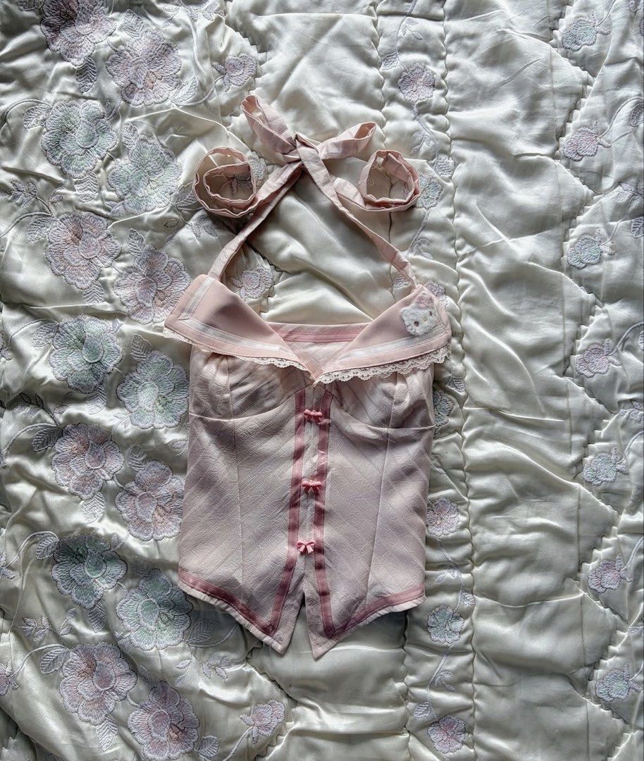 Y2k Hello Kitty Pink Halter Top (Category: Sleeveless) located in Dasmarinas. Submitted by keonhi.i (Listing ID 1461883479, Image 1). Description: hello kitty halter top (NEVER WORN) bought in a ig shop. size: XS-S bust: 36cm MOP: Gcash MOD: jnt, lalamove .