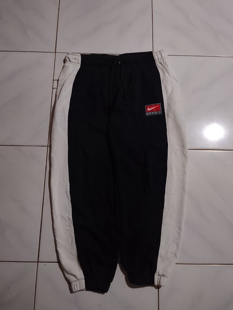 Y2k Nike Pants Swoosh (Category: Joggers) located in Cavite. Submitted by ara.thrifts (Listing ID 1461812954, Image 1). Description: - Nike Team sweatpants - Color: Black with white side panels - Size: XL - Width "16.5" length "38.5-39" no issue bnew 10/10 cr.