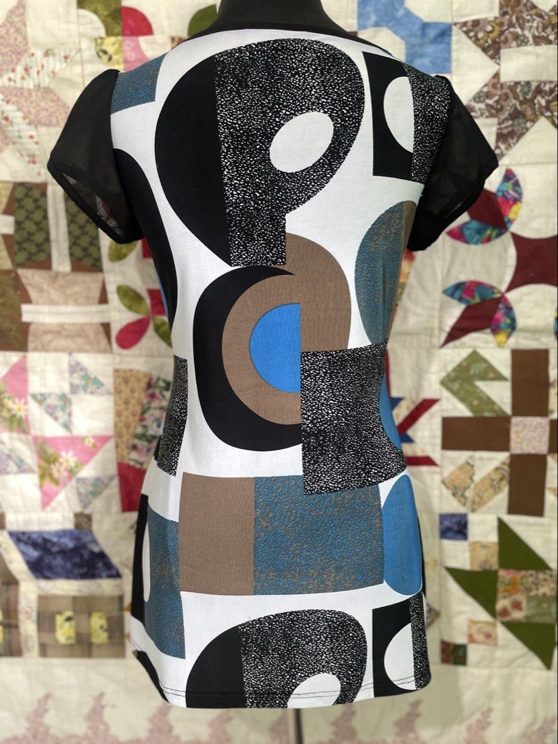 Y2K Retro Geometric Print Rhinestone Tunic Top - Medium (Category: Blouses) located in Roxas City. Submitted by budgetfindsroxasph (Listing ID 1461815693, Image 3). Description: Add a bold vintage vibe to your wardrobe with this stylish Y2K retro print tunic top! Features a geometric abstract pattern in blue, brown, black, and white, complete with sheer black cap sleeves and a sparkly rhinestone band detail under the bust. Size: Fit Medium (M) St