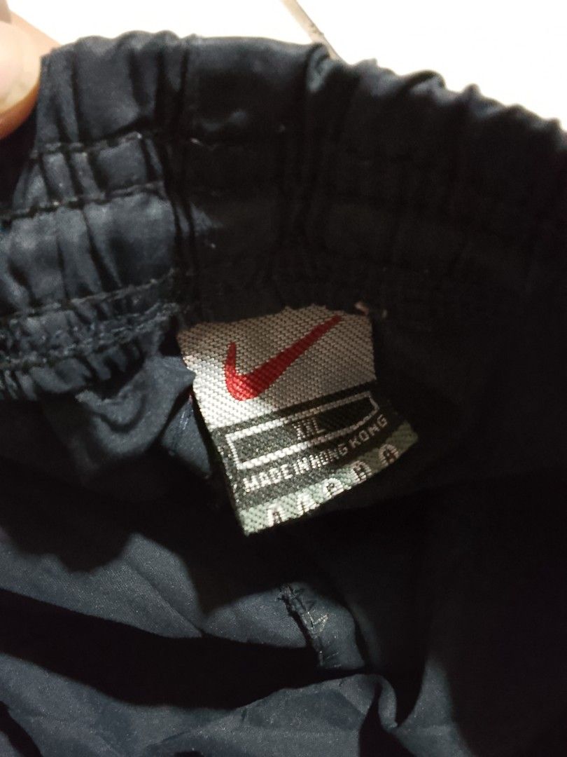 Y2k vintage shorts (Category: Shorts) located in Cavite. Submitted by ara.thrifts (Listing ID 1461814386, Image 3). Description: - Black Nike track shorts - Size XXL width "17" length "22" no issue bnew 10/10 cr - Features Nike logo on left leg - Reflective stripes on the side - Elastic waistband with drawstring - Perfect for sports or casual wear - Made in Hong Kong.