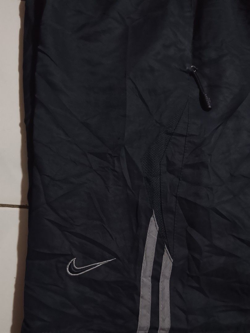 Y2k vintage shorts (Category: Shorts) located in Cavite. Submitted by ara.thrifts (Listing ID 1461814386, Image 2). Description: - Black Nike track shorts - Size XXL width "17" length "22" no issue bnew 10/10 cr - Features Nike logo on left leg - Reflective stripes on the side - Elastic waistband with drawstring - Perfect for sports or casual wear - Made in Hong Kong.