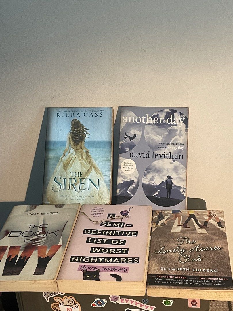 YA Fiction Book Bundle (Category: Storybooks) located in Manila. Submitted by declutteredbyalex (Listing ID 1461855396, Image 3). Description: ‼️STRICTLY SOLD AS A SET Titles Included: 1. Another Day by David Levithan 2. The Lonely Hearts Club by Elizabeth Eulberg 3. The Siren by Kiera Cass 4. A Semi-Definitive List of Worst Nightmares by Krysta Sutherland 5. The Book of Ivy by Amy Engel - Pre-loved condition - Intact covers with visible shelf we