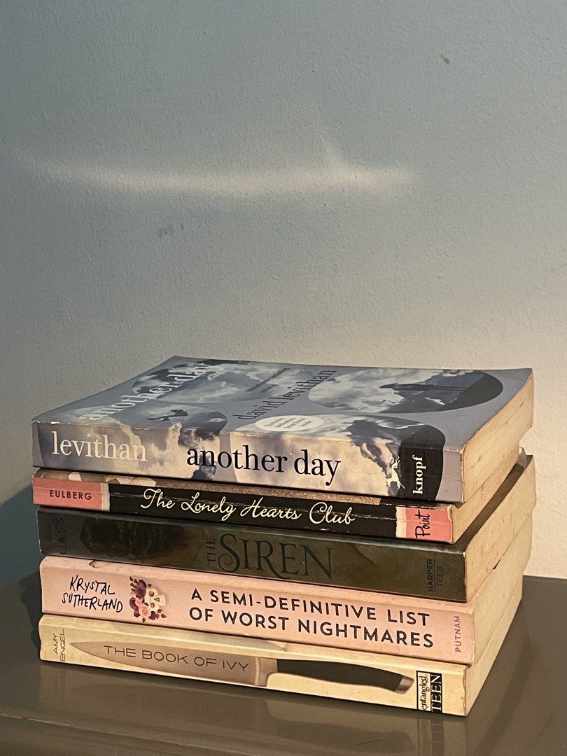 YA Fiction Book Bundle (Category: Storybooks) located in Manila. Submitted by declutteredbyalex (Listing ID 1461855396, Image 2). Description: ‼️STRICTLY SOLD AS A SET Titles Included: 1. Another Day by David Levithan 2. The Lonely Hearts Club by Elizabeth Eulberg 3. The Siren by Kiera Cass 4. A Semi-Definitive List of Worst Nightmares by Krysta Sutherland 5. The Book of Ivy by Amy Engel - Pre-loved condition - Intact covers with visible shelf we