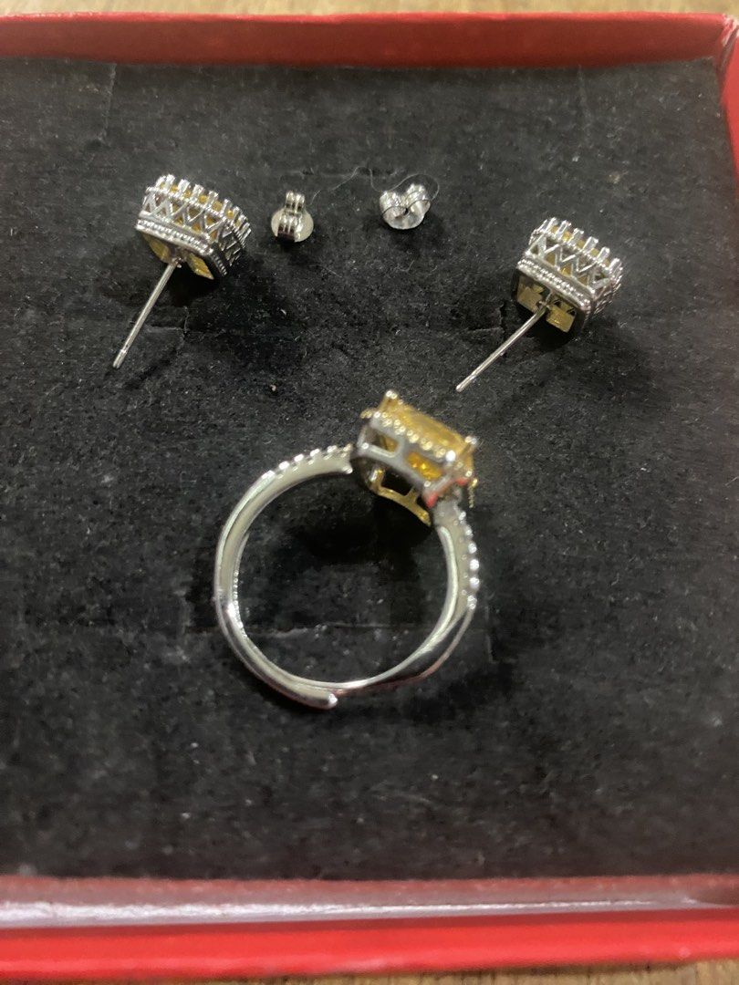 Yellow Gemstone Ring and Earrings Set Silver Tone (Category: Earrings) located in Cagayan de Oro. Submitted by ericlarkyl89146 (Listing ID 1461851966, Image 3). Description: - Stunning ring and matching earrings set. - Features a vibrant square-cut yellow gemstone. - Elegant silver-tone metal setting. - Accented with small sparkling stones. - Includes earring backs for secure wear. - Versatile for both special occasions and daily use..