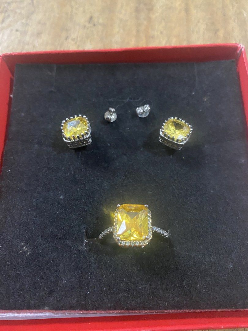Yellow Gemstone Ring and Earrings Set Silver Tone (Category: Earrings) located in Cagayan de Oro. Submitted by ericlarkyl89146 (Listing ID 1461851966, Image 2). Description: - Stunning ring and matching earrings set. - Features a vibrant square-cut yellow gemstone. - Elegant silver-tone metal setting. - Accented with small sparkling stones. - Includes earring backs for secure wear. - Versatile for both special occasions and daily use..