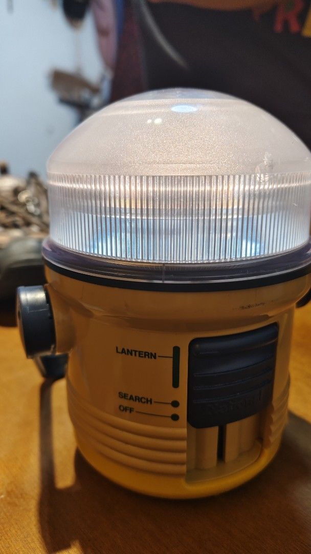 Yellow Lantern Search Light (Category: Everything Else Others) located in Bulacan. Submitted by babz30261 (Listing ID 1461919765, Image 3). Description: - Yellow lantern with search and lantern modes - Includes an off setting - Light is functional - Minor scuffs on casing - Ideal for camping or emergency use.