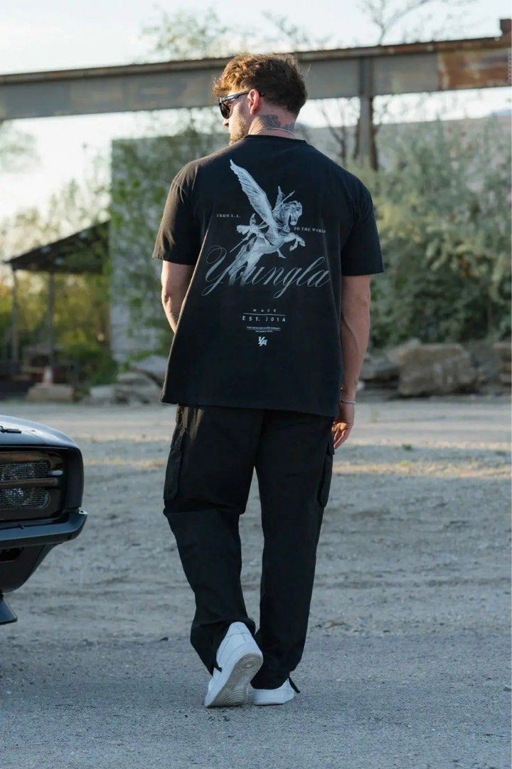 YOUNGLA Warrior Oversized Tee (Category: Activewear) located in Bayombong. Submitted by rethreadsactivewear (Listing ID 1461820313, Image 2). Description: ON-HAND! READY TO SHIP! YOUNGLA Warrior Oversized Shirt XLarge Brandnew without pouch 2000 only! Product Overview Material: 100% Premium Cotton (heavyweight streetwear build) Fit: Oversized / Generous streetwear cut Design & Features: This piece features a vintage, washed-black aesthetic comple