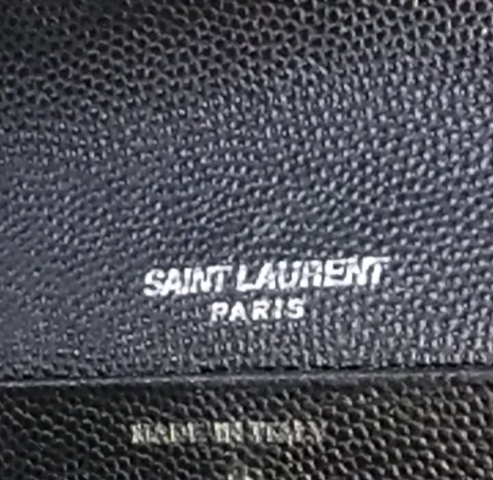 YSL Long Wallet (Category: Luxury Bags & Wallets) located in Taguig. Submitted by esa.agustin (Listing ID 1461810403, Image 3). Description: Original YSL leather black long envelope type wallet. Made in Italy..