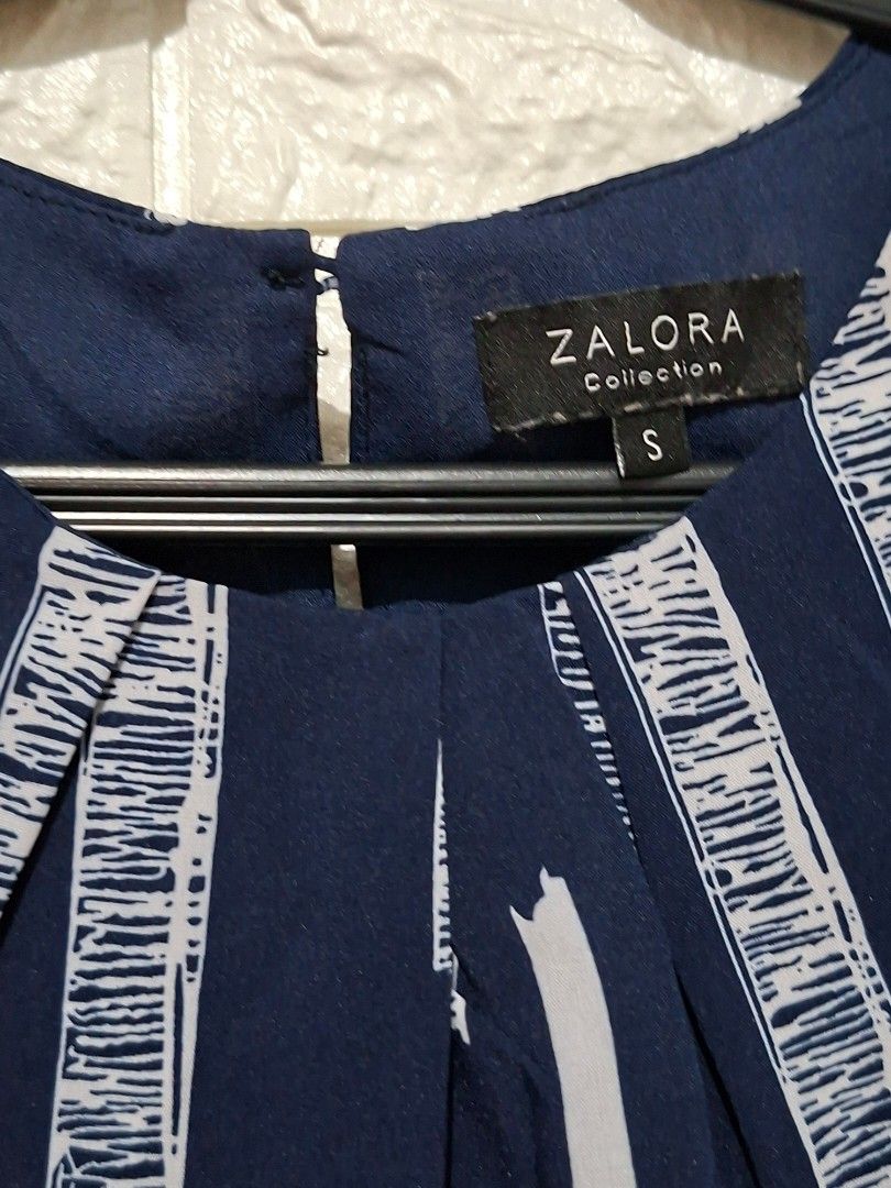 Zalora Collection Dress (Category: Dresses) located in Taguig. Submitted by authprelovedonlineshop2 (Listing ID 1461811103, Image 3). Description: - Zalora Collection Dress - Navy blue and white striped pattern - Sleeveless design - Flattering fit - Size: Small (S) - Zipper closure - Button detail - Like New Php388 🍀All items are preloved unless stated as brand new. 🍀Please manage your expectations. Major flaws will be indicated, if any. 🍀Colo